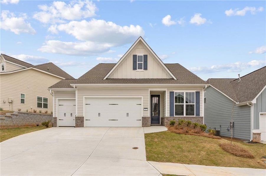 Front exterior of a new home in Heritage Pointe at The Georgian, Villa Rica, GA, highlighting curb appeal (Image 1). Front exterior of a new home in Heritage Pointe at The Georgian, Villa Rica, GA, highlighting curb appeal (Image 1).