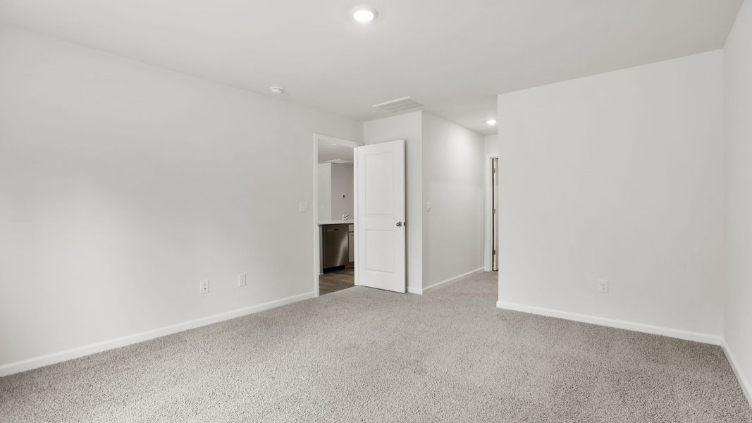 Spacious, unfurnished interior of a new home in Bentley Park, Greenwood (Image 24).