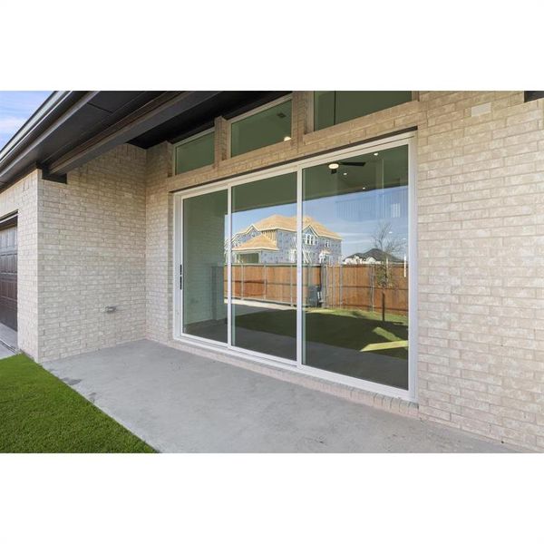 Front exterior of a new home in Trails at Cottonwood Creek, Rowlett, TX, highlighting curb appeal (Image 2). Front exterior of a new home in Trails at Cottonwood Creek, Rowlett, TX, highlighting curb appeal (Image 2).