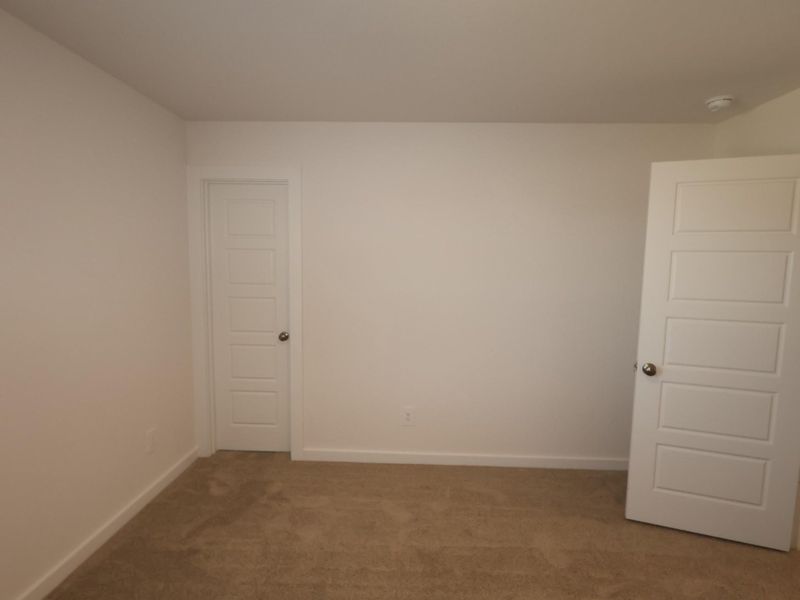 Spacious, unfurnished interior of a new home in Pinewood at Grand Texas, New Caney (Image 24).