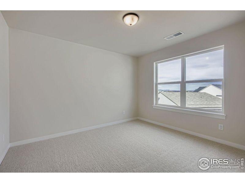 Spacious, unfurnished interior of a new home in RainDance National 60/70, Windsor (Image 19).