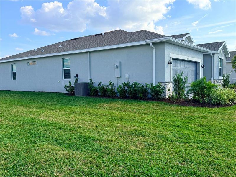 Exterior details and patio area of a home in Island Lakes at Coco Bay: Executive Homes, Englewood (Image 3).