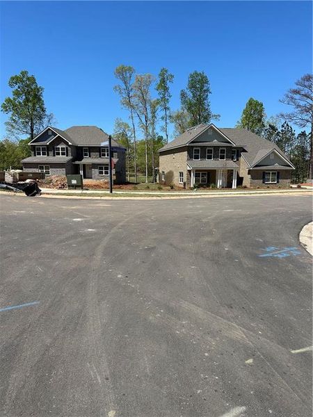 Front exterior of a new home in Mirror Lake at South Harbour, Villa Rica, GA, highlighting curb appeal (Image 24).