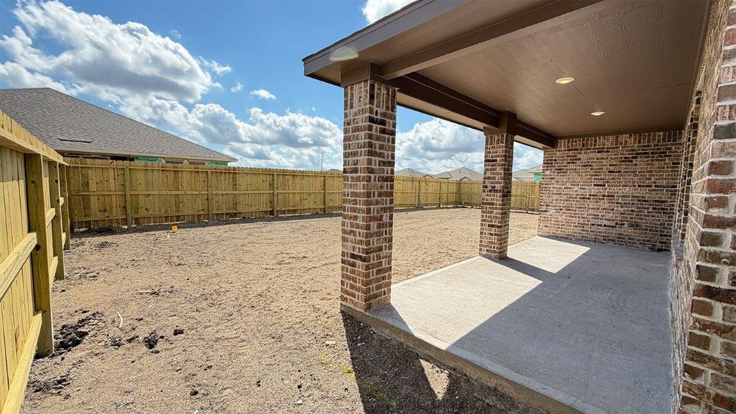Exterior details and patio area of a home in The Lakes Northwest, Robstown (Image 18).