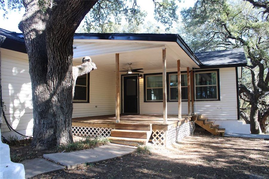 View of front of home with a ceiling fan and a porch View of front of home with a ceiling fan and a porch