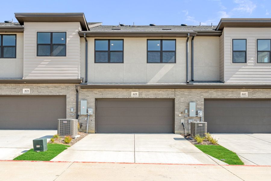 Front exterior of a new home in Wildridge, Oak Point, TX, highlighting curb appeal (Image 28). Front exterior of a new home in Wildridge, Oak Point, TX, highlighting curb appeal (Image 28).