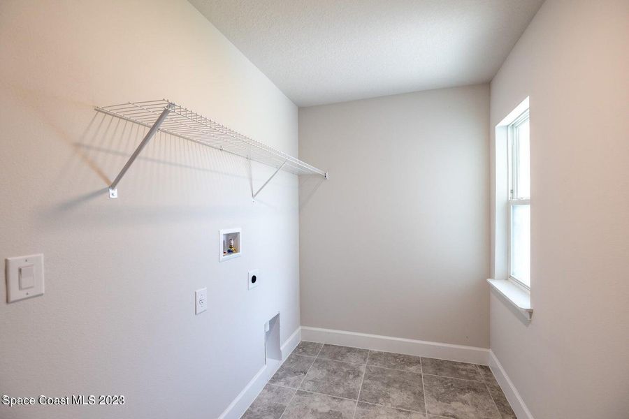 Representative unfurnished interior of a home built from the 1415 by Adams Homes in Winding Oaks, Weeki Wachee (Image 15).