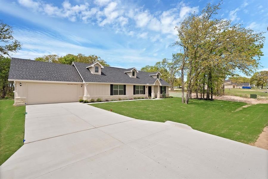 Front exterior of a new home in , Poolville, TX, highlighting curb appeal (Image 19).