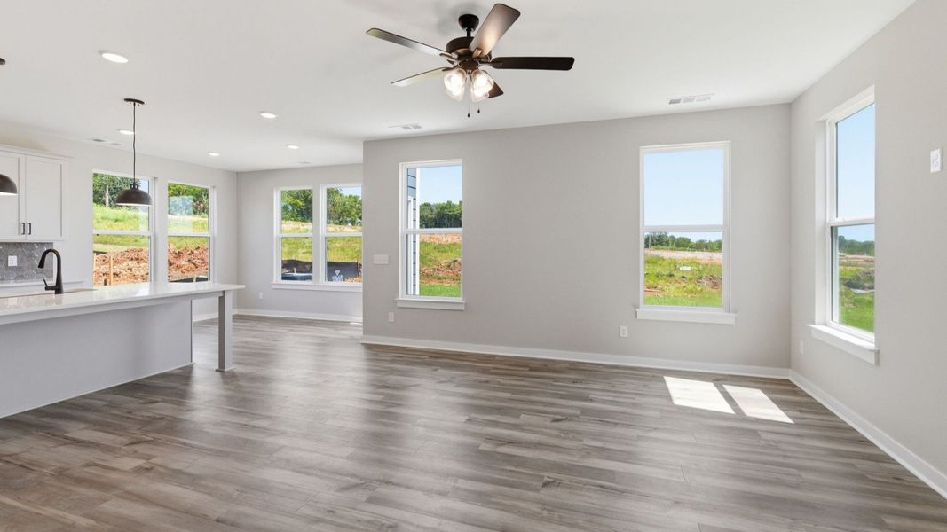 Gathering room with hard surface flooring and ceiling fan Gathering room with hard surface flooring and ceiling fan