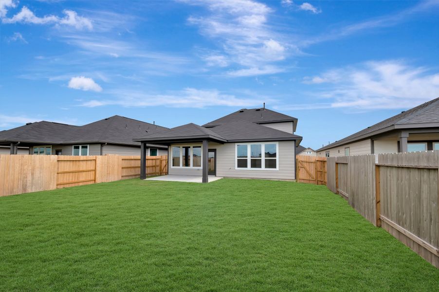 Exterior details and patio area of a home in Mason Woods, Cypress (Image 22).
