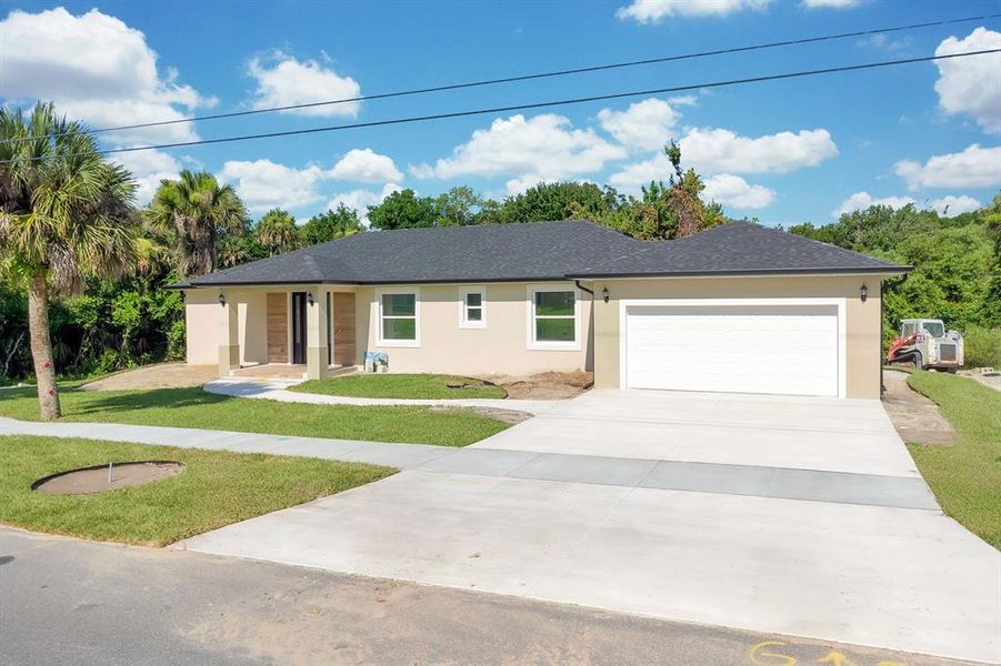 Front exterior of a new home in , Titusville, FL, highlighting curb appeal (Image 24).