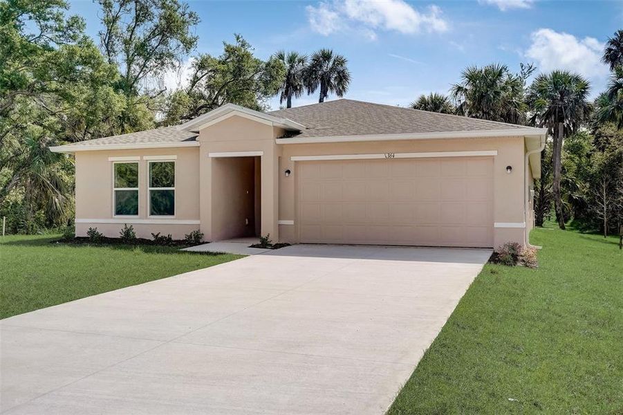 Front exterior of a new home in Citrus Springs, Citrus Springs, FL, highlighting curb appeal (Image 8).
