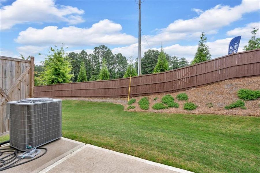 Exterior details and patio area of a home in Park Center Pointe, Austell (Image 4).