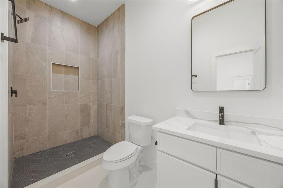 The guest ensuite bathroom features a spacious walk-in shower and elegantly appointed fixtures, creating a refined and inviting space for family members or overnight guests. The guest ensuite bathroom features a spacious walk-in shower and elegantly appointed fixtures, creating a refined and inviting space for family members or overnight guests.