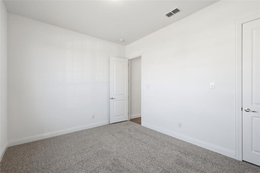 Unfurnished room featuring carpet floors and baseboards Unfurnished room featuring carpet floors and baseboards