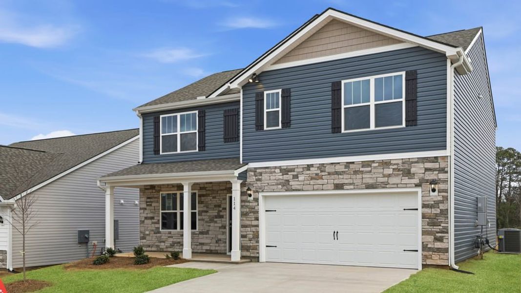 Front exterior of a new home in Lakestone, Woodruff, SC, highlighting curb appeal (Image 2). Front exterior of a new home in Lakestone, Woodruff, SC, highlighting curb appeal (Image 2).