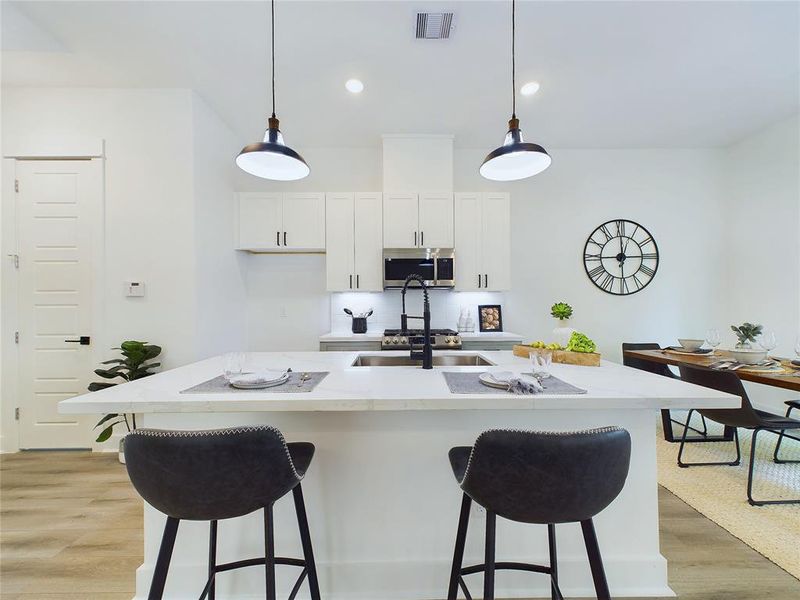 This attractive Kitchen is full of beautiful details. Quartz Countertops, Stainless Steel Sink, Stainless Steel Appliances, Recessed Lighting, Undercabinet Lighting, Elegant Cabinetry with Soft Close Drawers and Doors. Model home photos, finishes and floor plan MAY VARY!