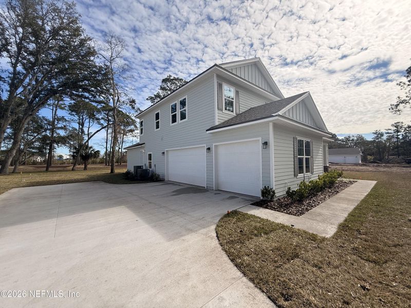 Front exterior of a new home in , Fernandina Beach, FL, highlighting curb appeal (Image 2). Front exterior of a new home in , Fernandina Beach, FL, highlighting curb appeal (Image 2).