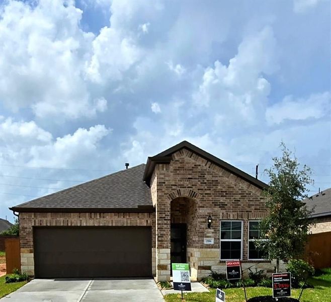 Front exterior of a new home in Sunterra, Katy, TX, highlighting curb appeal (Image 66). Front exterior of a new home in Sunterra, Katy, TX, highlighting curb appeal (Image 66).