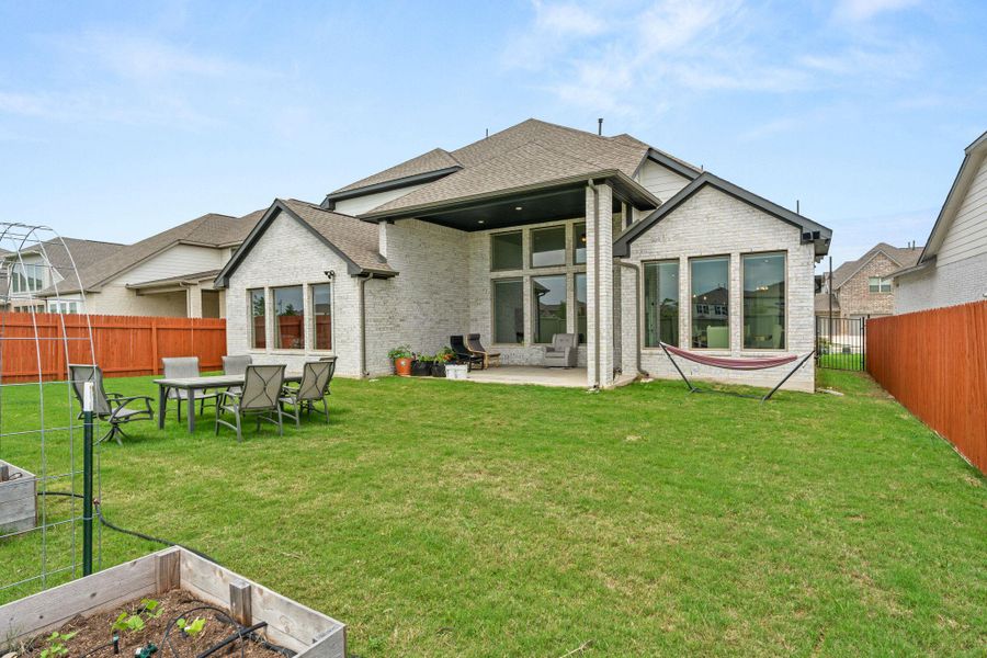Exterior details and patio area of a home in Santa Rita Ranch, Liberty Hill (Image 24).