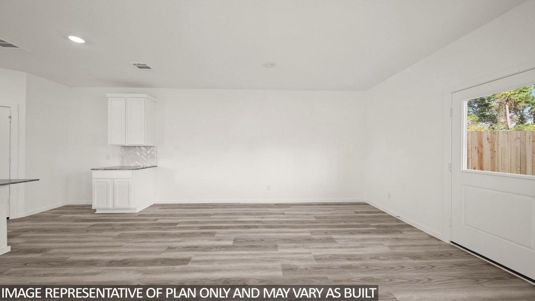Open-concept room featuring wood-finish flooring, white walls, and recessed lighting