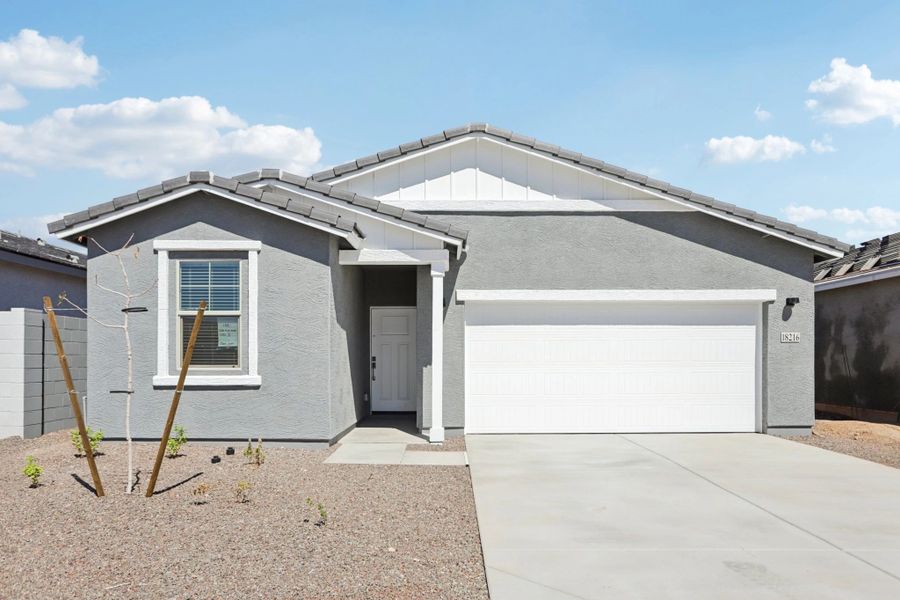 Iris Farmhouse Exterior elevation. Finishes and colors may vary by community.