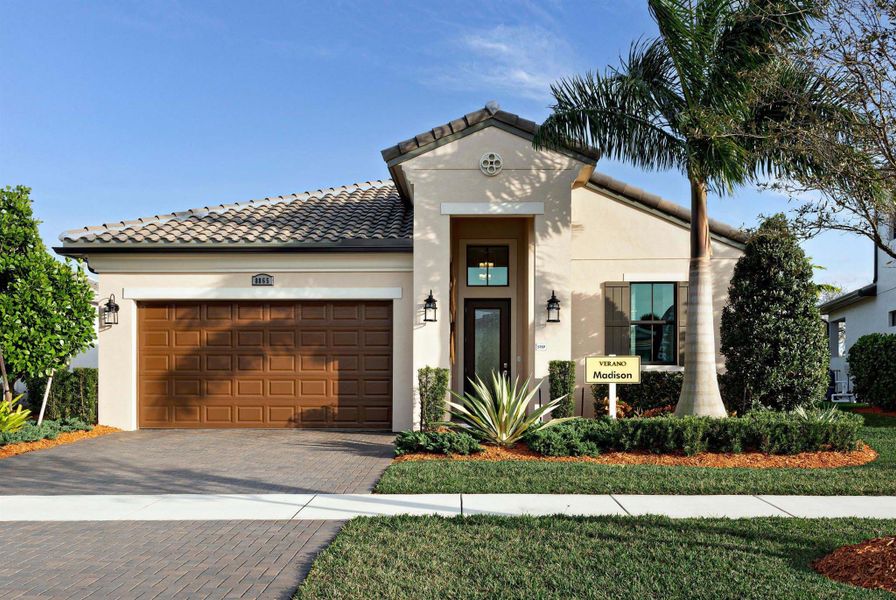 Front exterior of a new home in PGA Village Verano, Port St. Lucie, FL, highlighting curb appeal (Image 2).