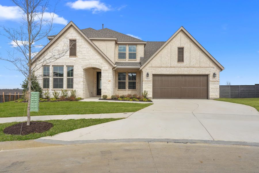 Front exterior of a new home in Union Park, Little Elm, TX, highlighting curb appeal (Image 1). Front exterior of a new home in Union Park, Little Elm, TX, highlighting curb appeal (Image 1).