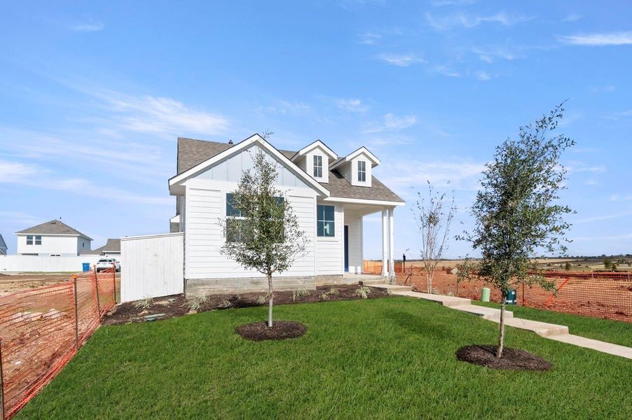 Front exterior of a new home in Harvest Ridge, Elgin, TX, highlighting curb appeal (Image 19).