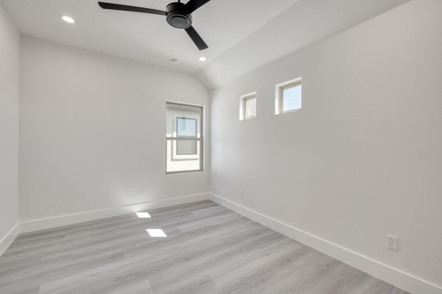 Empty room featuring recessed lighting, light wood-style floors, and baseboards