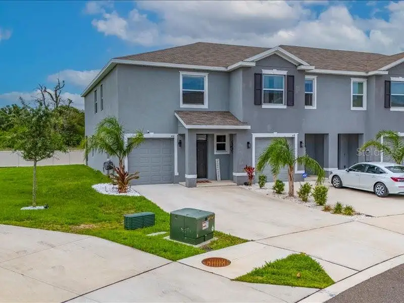 Front exterior of a new home in , Apollo Beach, FL, highlighting curb appeal (Image 30).