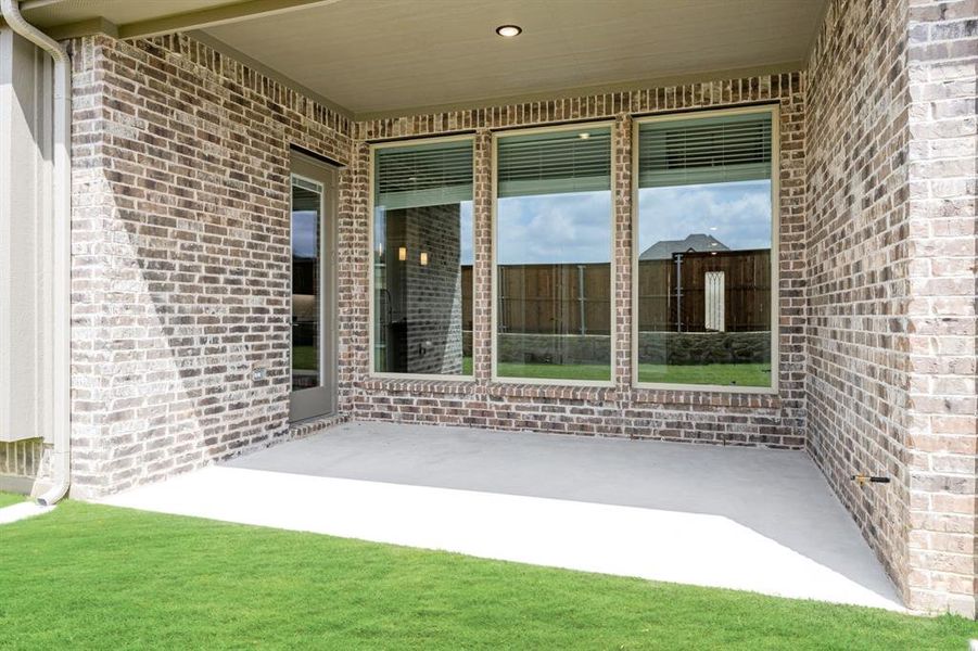 Exterior details and patio area of a home in Creekview Meadows, Pilot Point (Image 4).
