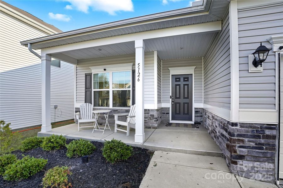 Exterior details and patio area of a home in Orchard Creek, Charlotte (Image 20).