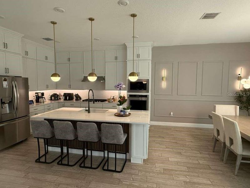 Furnished interior view inside a new home in Parkview Reserve, Orlando (Image 12).