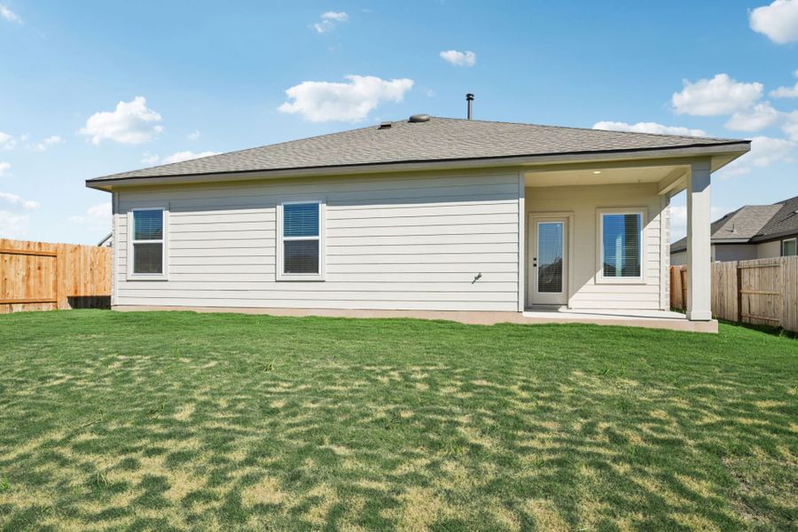 Exterior details and patio area of a home in Village at Three Oaks, Seguin (Image 18).