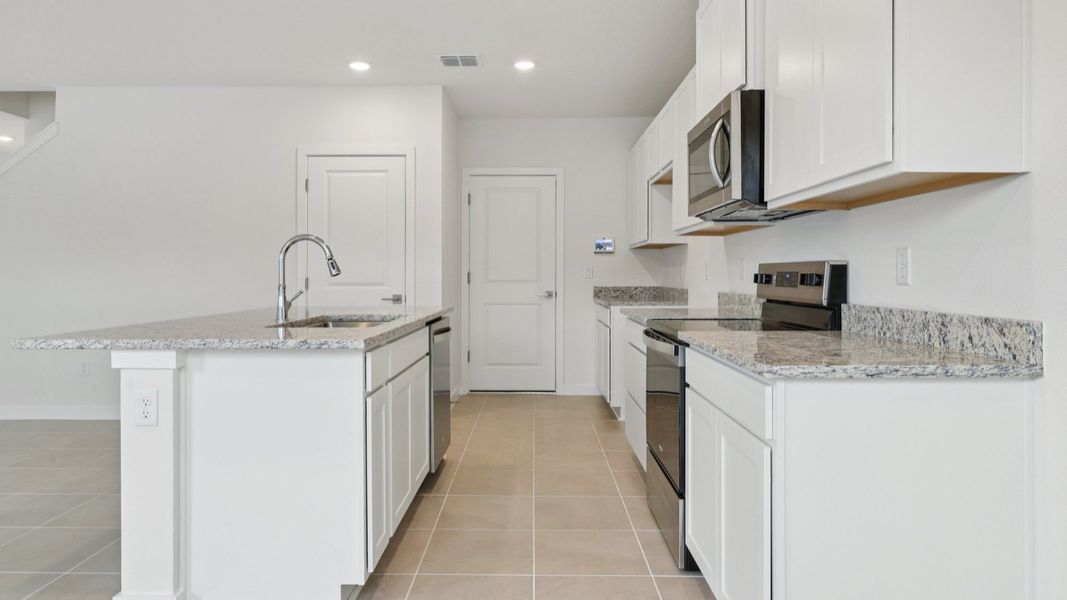 Kitchen of the Coronado - End at Cyrene at Harmony located in St Cloud FL by DRB Homes