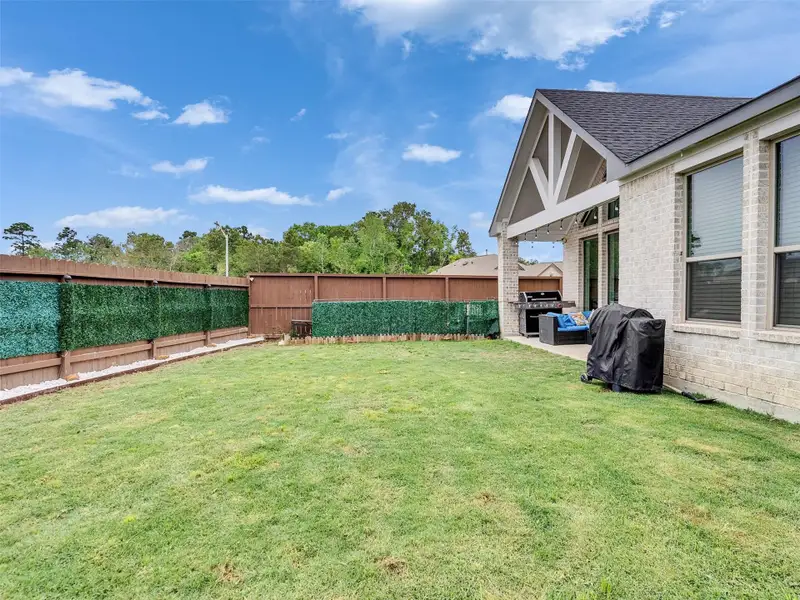 Exterior details and patio area of a home in The Trails, New Caney (Image 4).