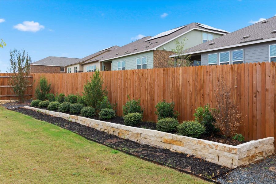 Exterior details and patio area of a home in Thunder Rock: Watermill Collection, Marble Falls (Image 23).