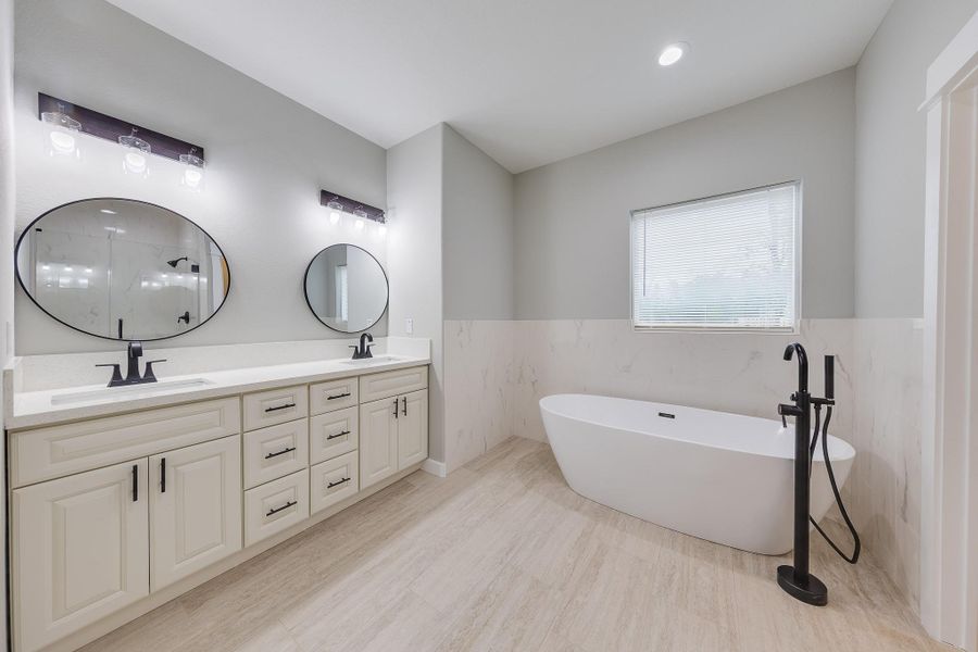 Primary bath with a luxurious soaking tub, perfect for unwinding and enjoying a relaxing, spa-like experience. Primary bath with a luxurious soaking tub, perfect for unwinding and enjoying a relaxing, spa-like experience.