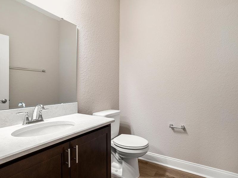 And, a powder room serves your guests - Monroe 55+ by Highland Homes