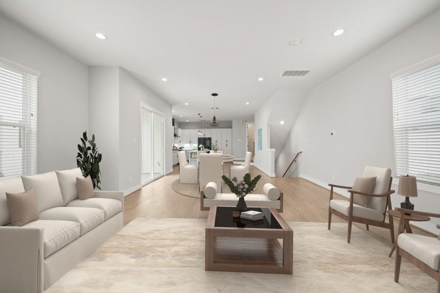 With its central location, the family room is a flexible space with a multitude of furniture space. It's filled with natural light and sits just steps from the kitchen, dining area and staircase for added convenience. This room has been virtually staged. With its central location, the family room is a flexible space with a multitude of furniture space. It's filled with natural light and sits just steps from the kitchen, dining area and staircase for added convenience. This room has been virtually staged.