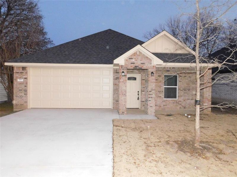 View of front of home featuring a garage