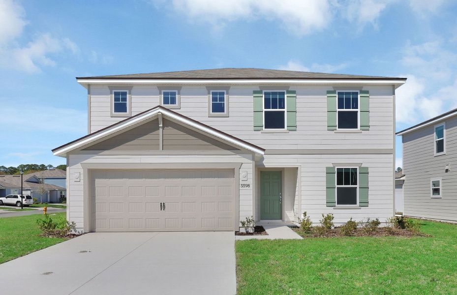 Front exterior of a new home in Wells Landing, Jacksonville, FL, highlighting curb appeal (Image 1).