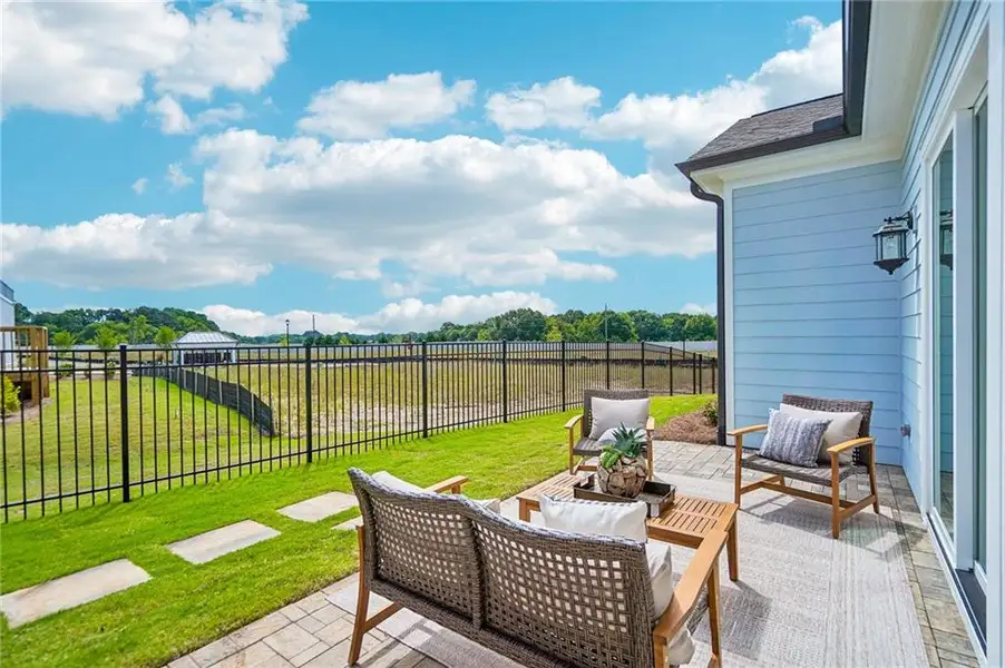 Exterior details and patio area of a home in The Villas at Aberdeen, Hoschton (Image 4).