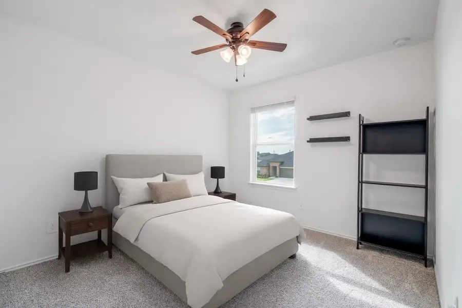 his versatile secondary bedroom offers a bright and comfortable space with plush carpet, neutral tones, and a ceiling fan. Perfect as a guest room, home office, or kids’ room, it provides flexibility to suit your lifestyle. his versatile secondary bedroom offers a bright and comfortable space with plush carpet, neutral tones, and a ceiling fan. Perfect as a guest room, home office, or kids’ room, it provides flexibility to suit your lifestyle.