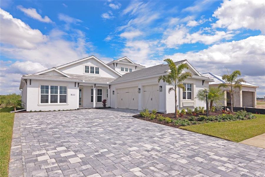 Front exterior of a new home in , Sarasota, FL, highlighting curb appeal (Image 26).