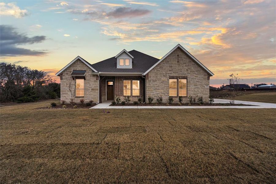 Front exterior of a new home in Nash Estates, Tom Bean, TX, highlighting curb appeal (Image 1). Front exterior of a new home in Nash Estates, Tom Bean, TX, highlighting curb appeal (Image 1).
