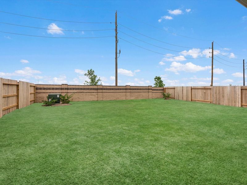 Exterior details and patio area of a home in Mason Woods, Cypress (Image 3).