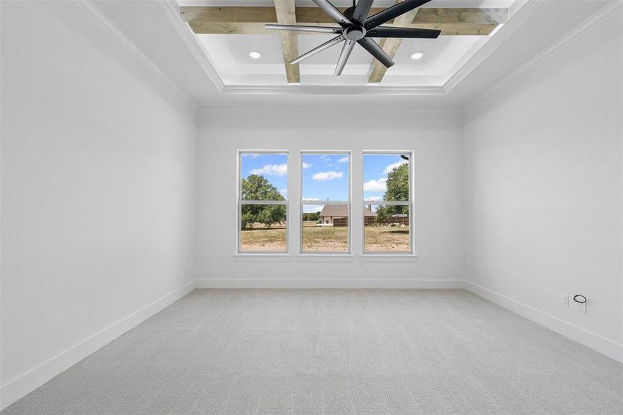 Unfurnished room with light colored carpet, ceiling fan, beamed ceiling, coffered ceiling, and recessed lighting Unfurnished room with light colored carpet, ceiling fan, beamed ceiling, coffered ceiling, and recessed lighting