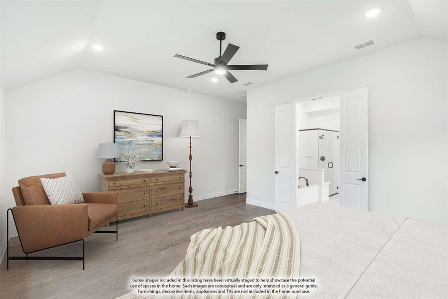 Master bedroom with vaulted ceiling, ceiling fan, hardwood floors, and ensuite bathroom visible through open door Master bedroom with vaulted ceiling, ceiling fan, hardwood floors, and ensuite bathroom visible through open door